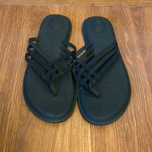 Black Sanuk flip flops